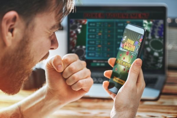 Filipino player using 2026 bet mobile app on smartphone